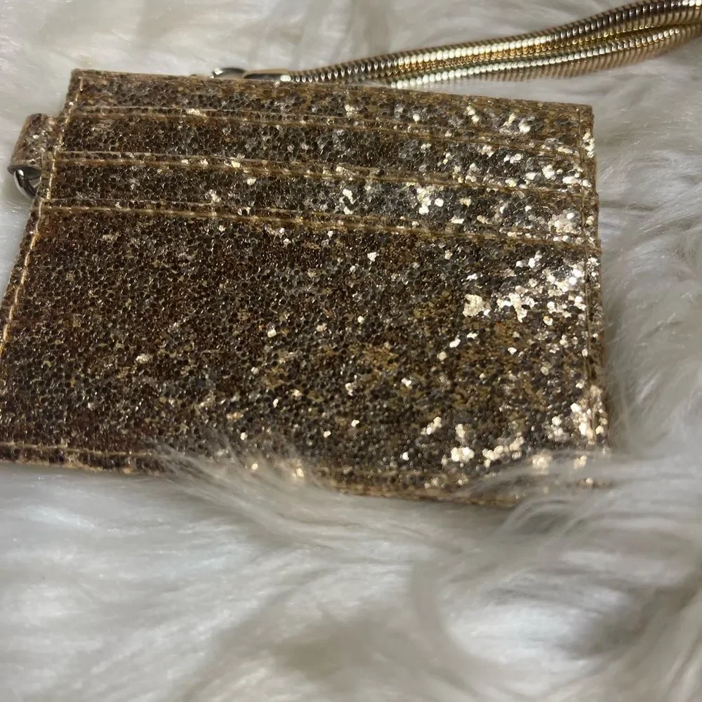 Retractable ID holder gold glitter with detachable gold tone chain .